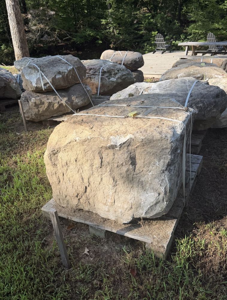 Large boulder staged near the deck